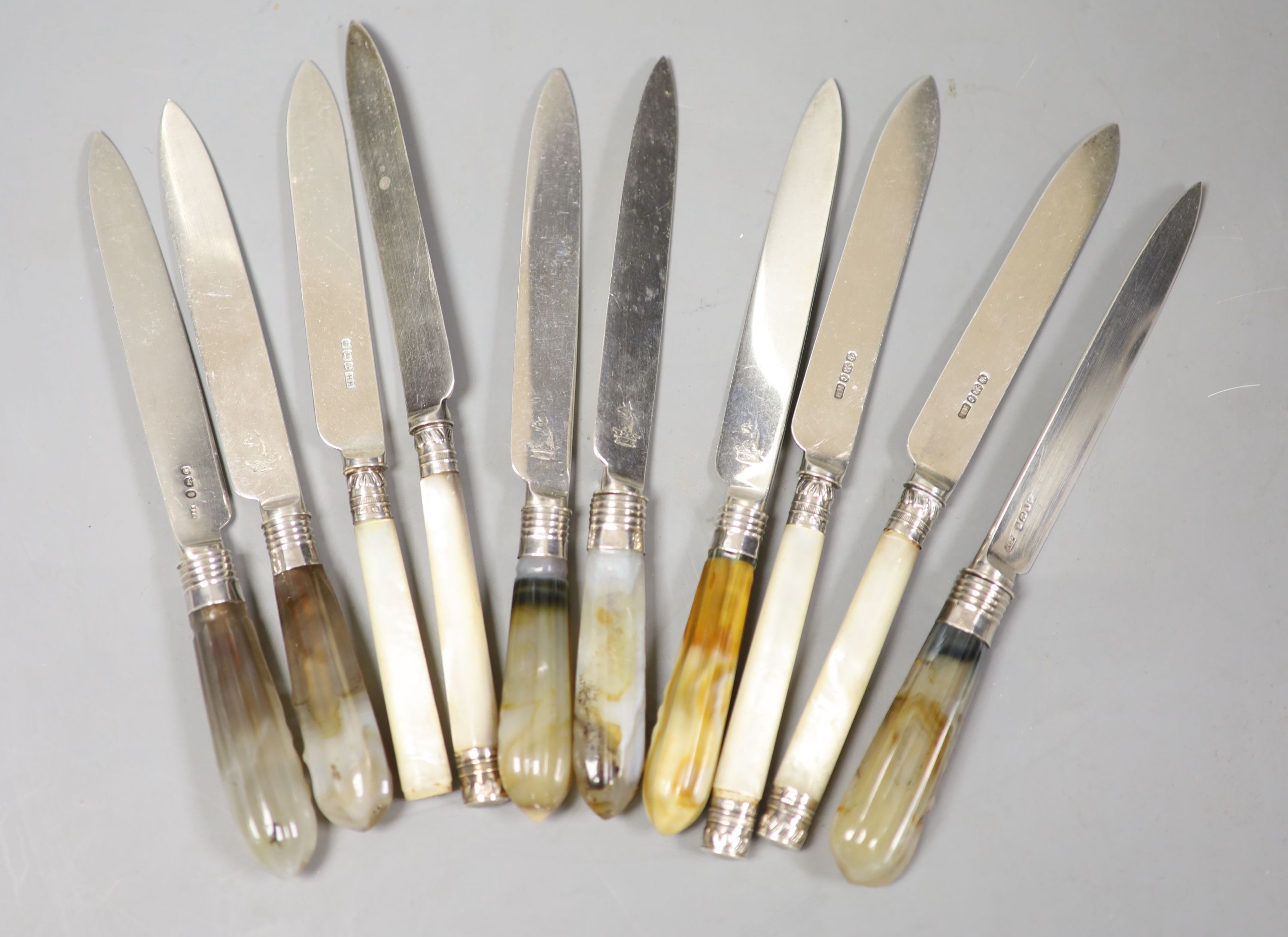 A matched set of six early 19th century agate handled silver dessert knives, Moses Emanuel?, London, 1802(5) and RP, London, 1824 and four other mother of pearl handles silver dessert knives.